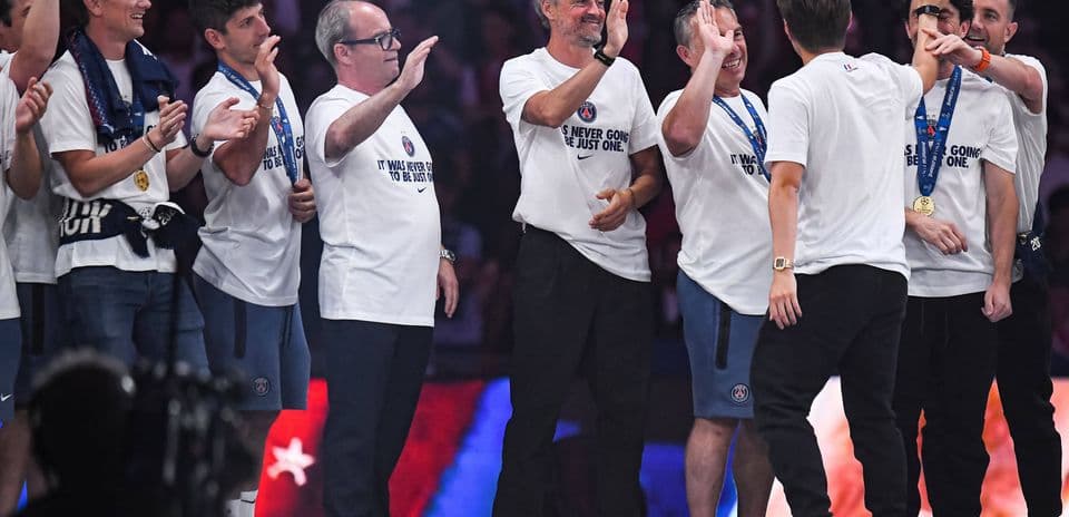 Celebration of team members wearing medals on stage