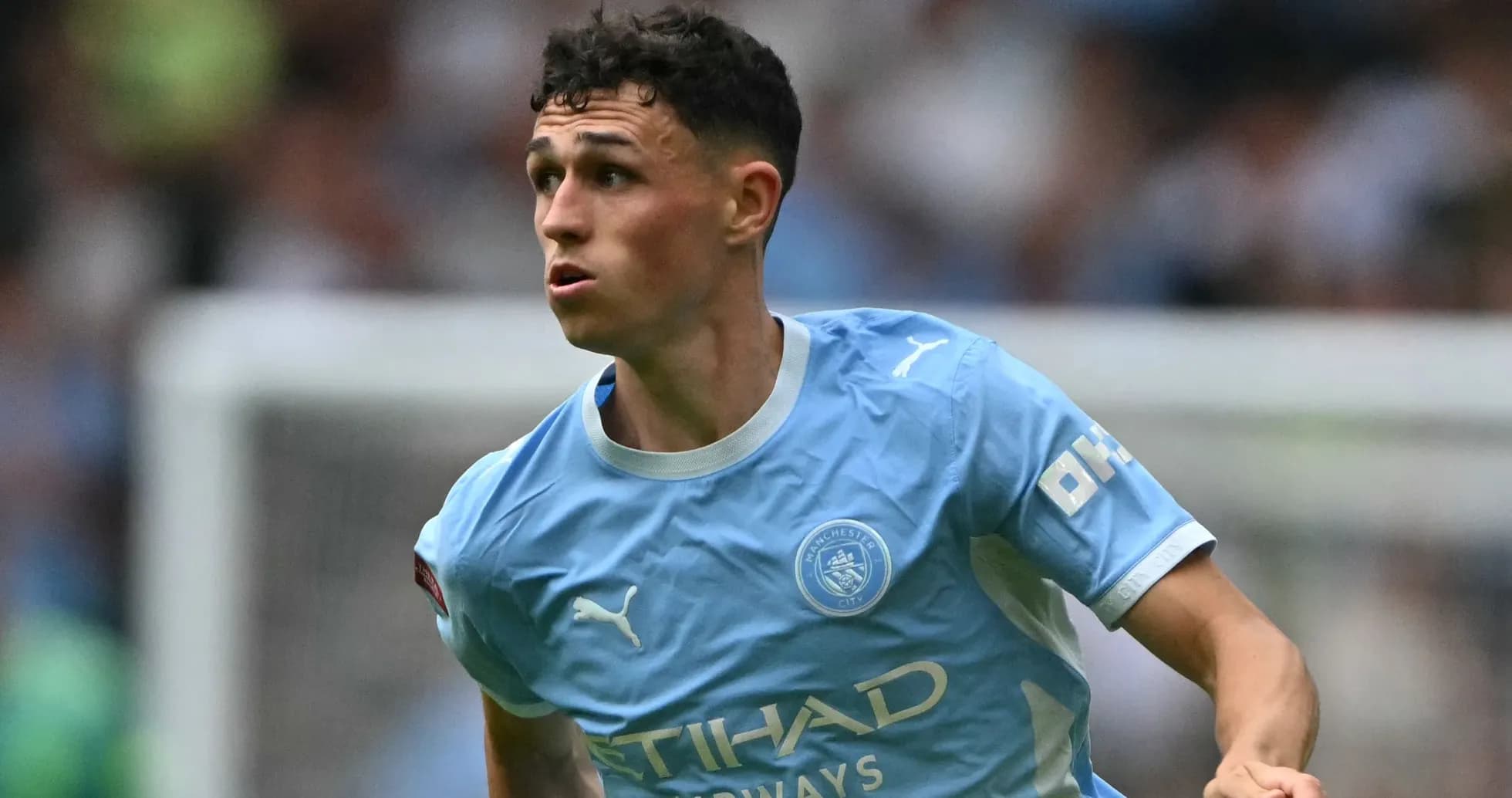 Jugador de Manchester City corriendo en el campo