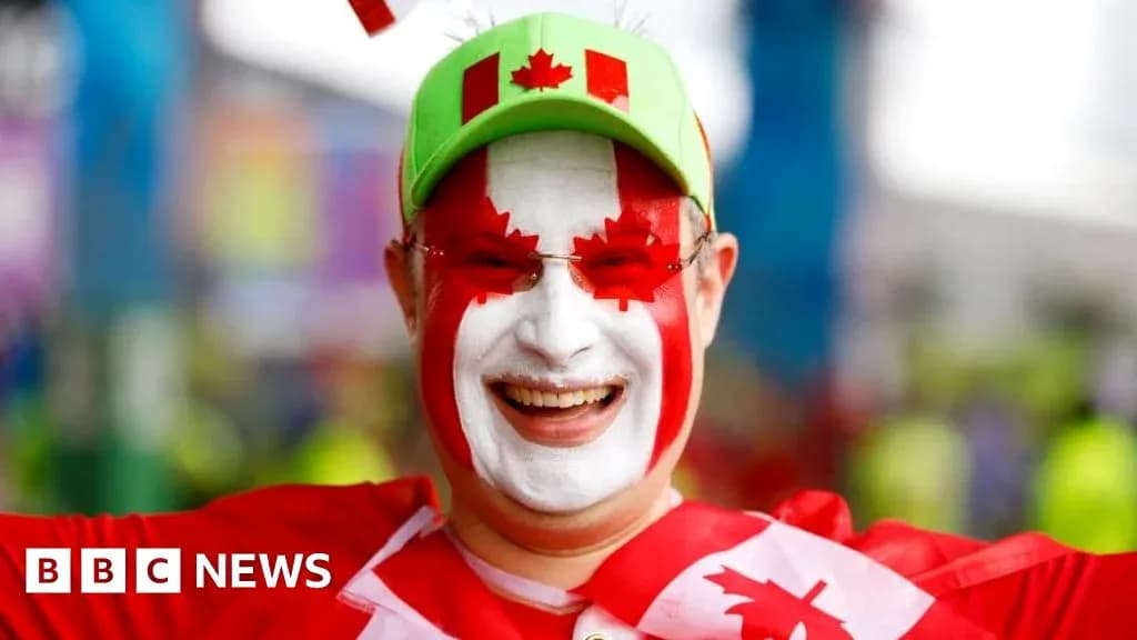 A fan with painted face celebrating at event