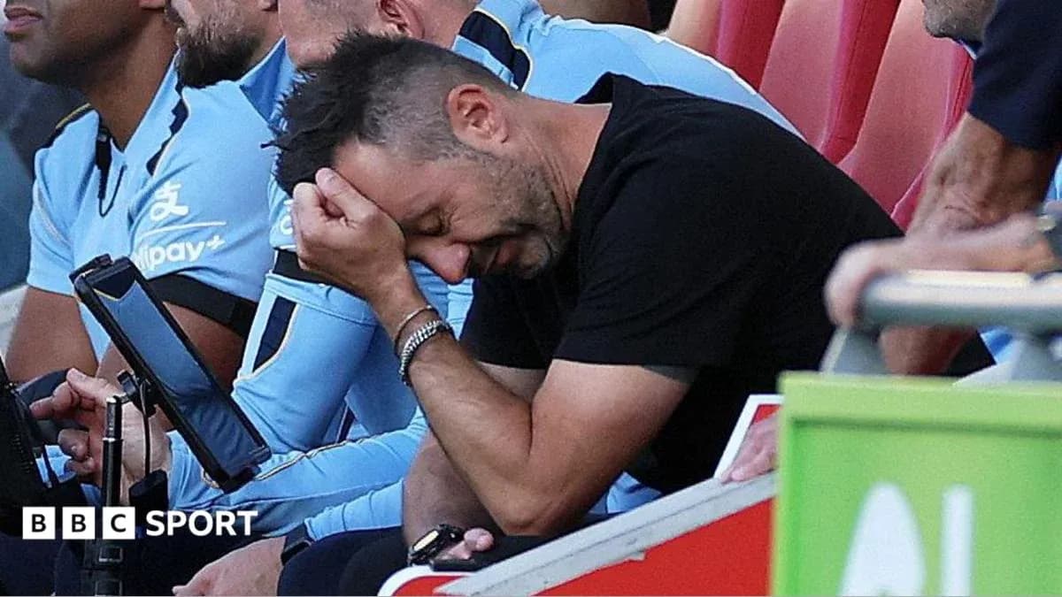 Entrenador preocupado sentado en el banquillo