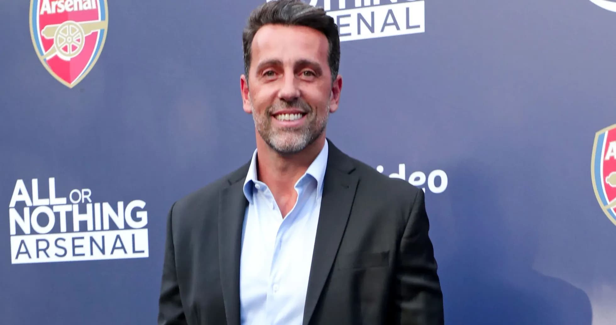 Persona sonriente en evento de Arsenal