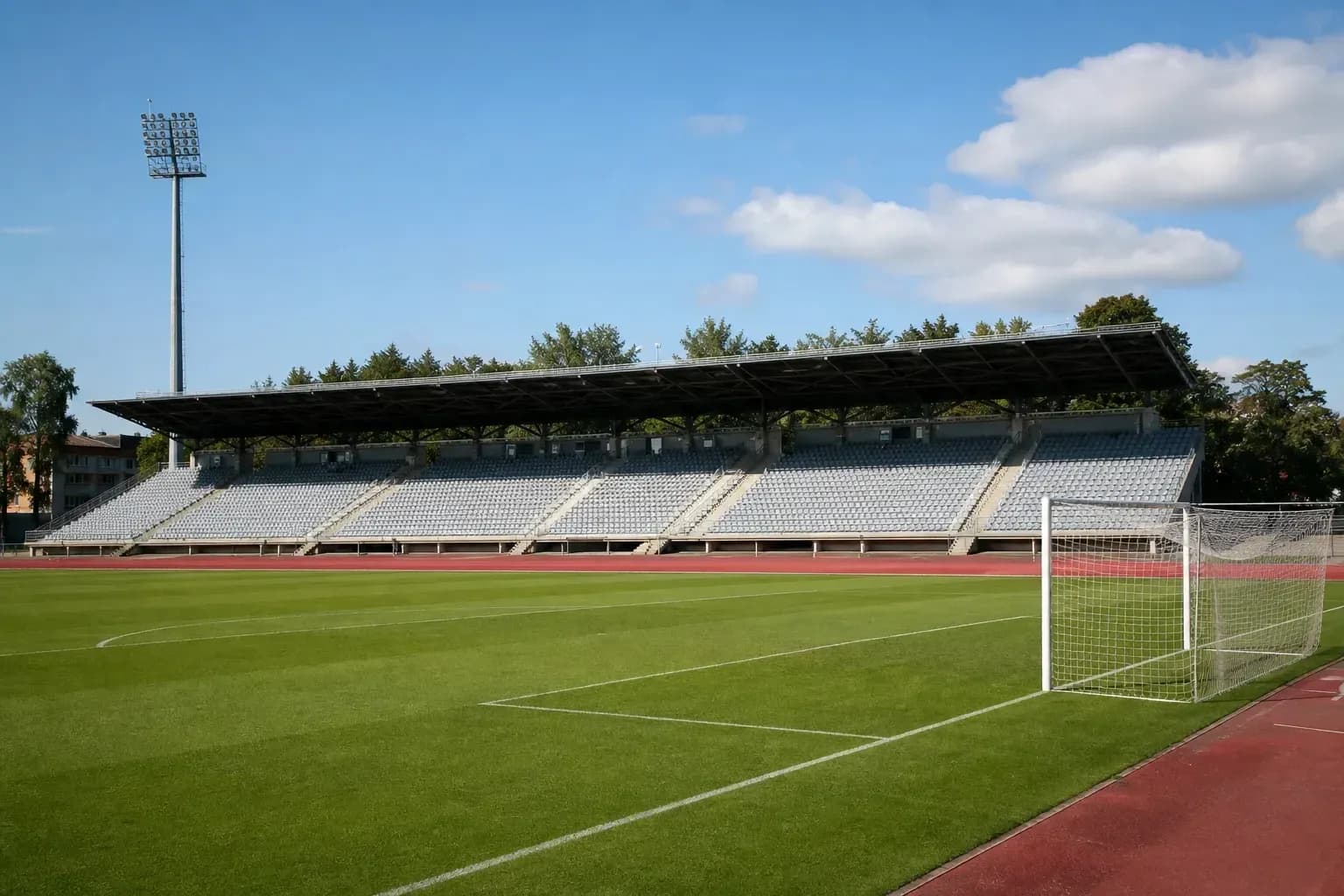 Estadio vacío con gradas y campo de fútbol Estadio vacío con gradas y campo de fútbol
