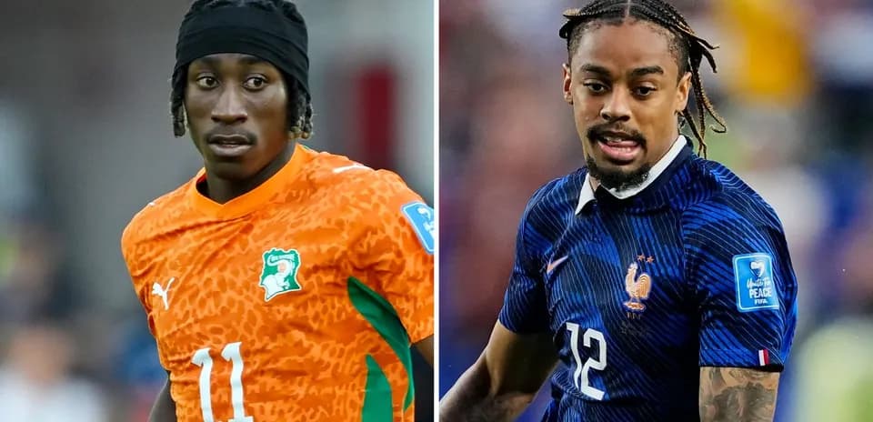 Jugadores de fútbol de Costa de Marfil y Francia en acción Jugadores de fútbol de Costa de Marfil y Francia en acción
