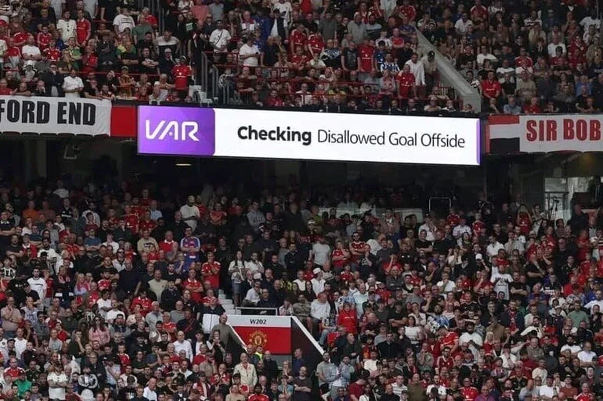 A crowd watching VAR decision on disallowed goal A crowd watching VAR decision on disallowed goal