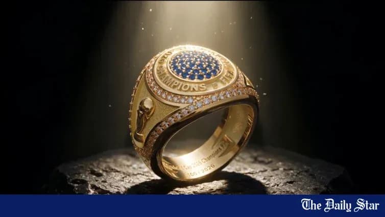 An illuminated championship ring on a dark surface An illuminated championship ring on a dark surface