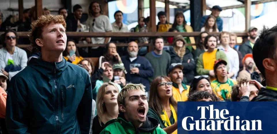 A crowd of fans watching a sports event A crowd of fans watching a sports event