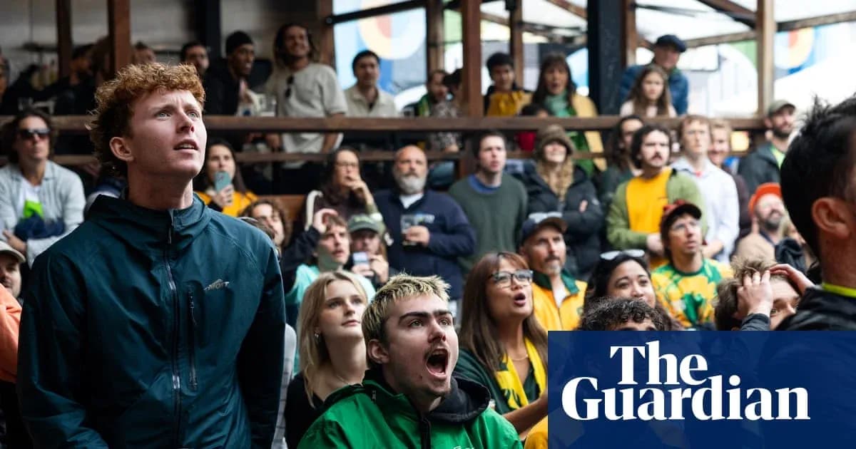 A crowd of fans watching a sports event A crowd of fans watching a sports event